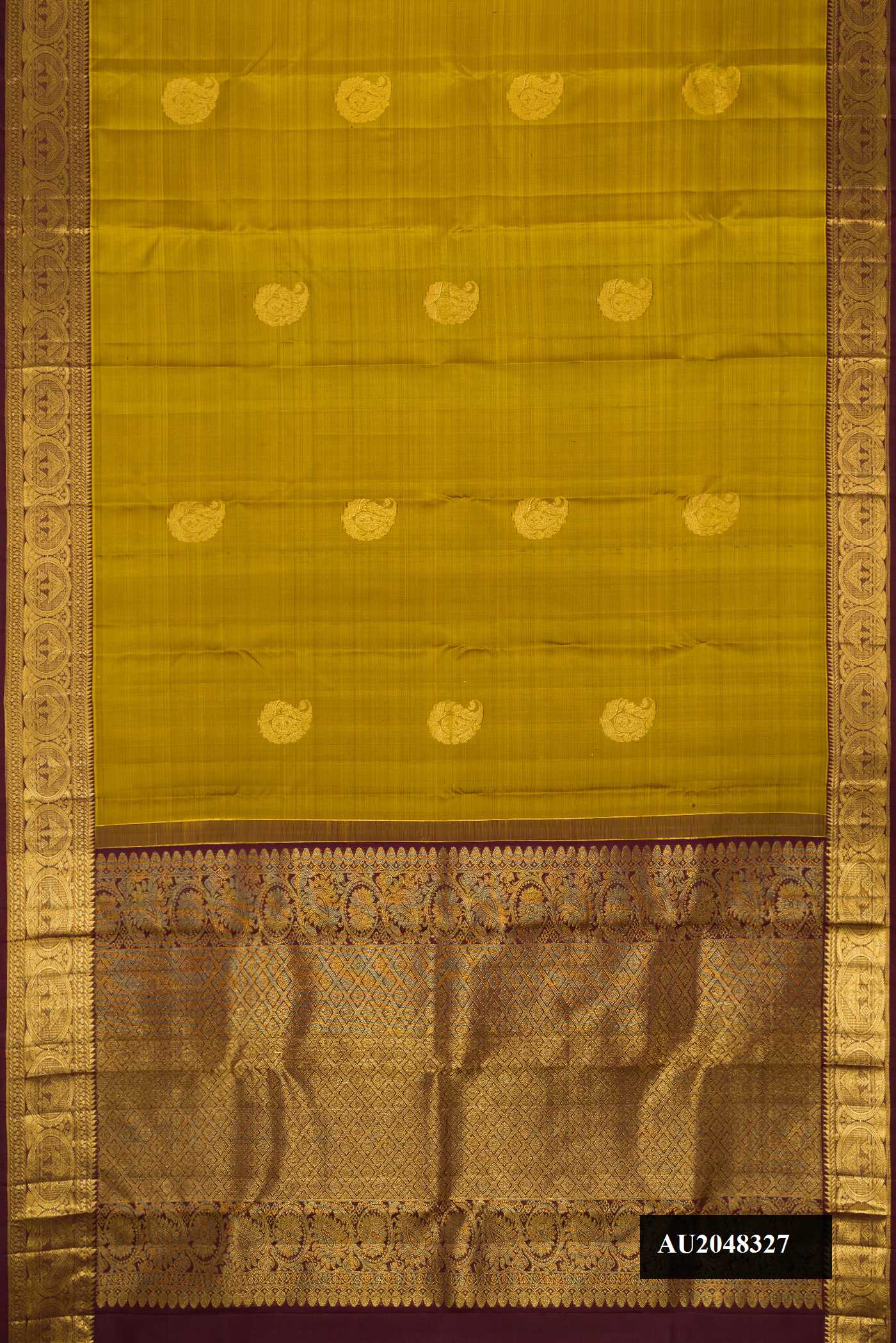 Mehandi Green Dual Tone Kanchipuram Silk Saree with Zari Butta on the body and Zari Border.  displayed on a mannequin