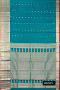 Sky Blue Dual Tone Kanchipuram Silk Saree with Zari Butta on the body and Zari Border.  displayed on a mannequin
