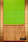 Parrot Green Dual Tone Kanchipuram Silk Saree with Zari Butta on the body and Zari Border.  displayed on a mannequin