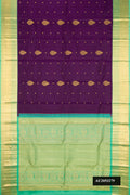 Violet Dual Tone Kanchipuram Silk Saree with Zari Butta on the body and Zari Border.  displayed on a mannequin