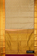 Dark Beige Dual Tone Kanchipuram Silk Saree with Zari Butta on the body and Zari Border.  displayed on a mannequin