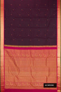 Burgundy Dual Tone Kanchipuram Silk Saree with Zari Butta on the body and Zari Border.  displayed on a mannequin