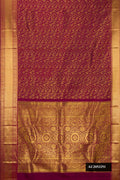 Maroon Dual Tone Kanchipuram Silk Saree with Zari Brocade on the body and Zari Border.  displayed on a mannequin
