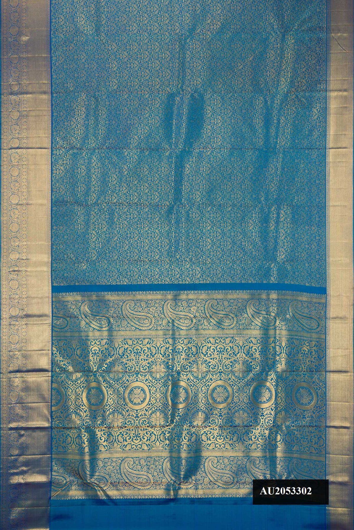 Peacock Blue Dual Tone Kanchipuram Silk Saree with Zari Brocade on the body and Zari Border.  displayed on a mannequin