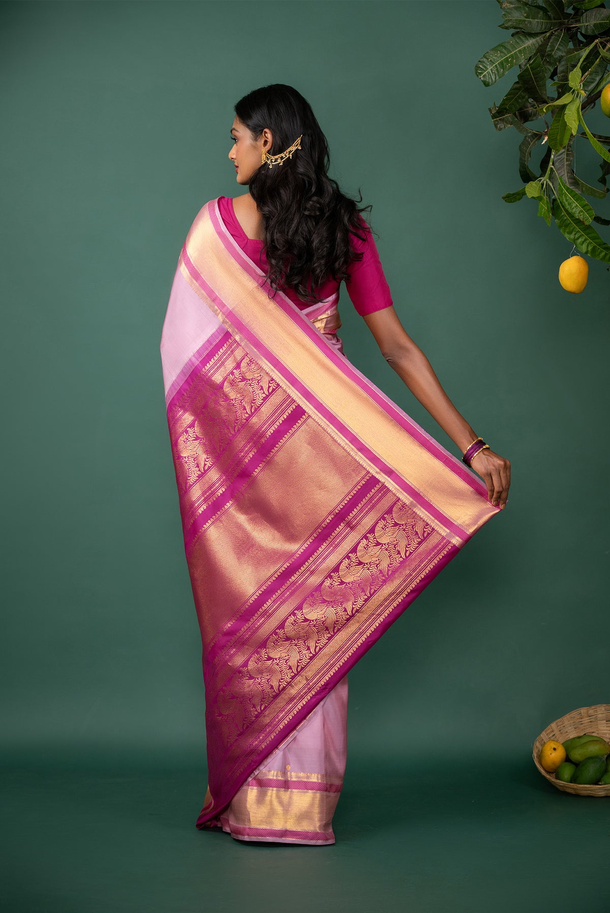 Close up image of the pallu of Pink Kanchipuram Silk Saree with Zari Butta on the body and Zari And Thread Border