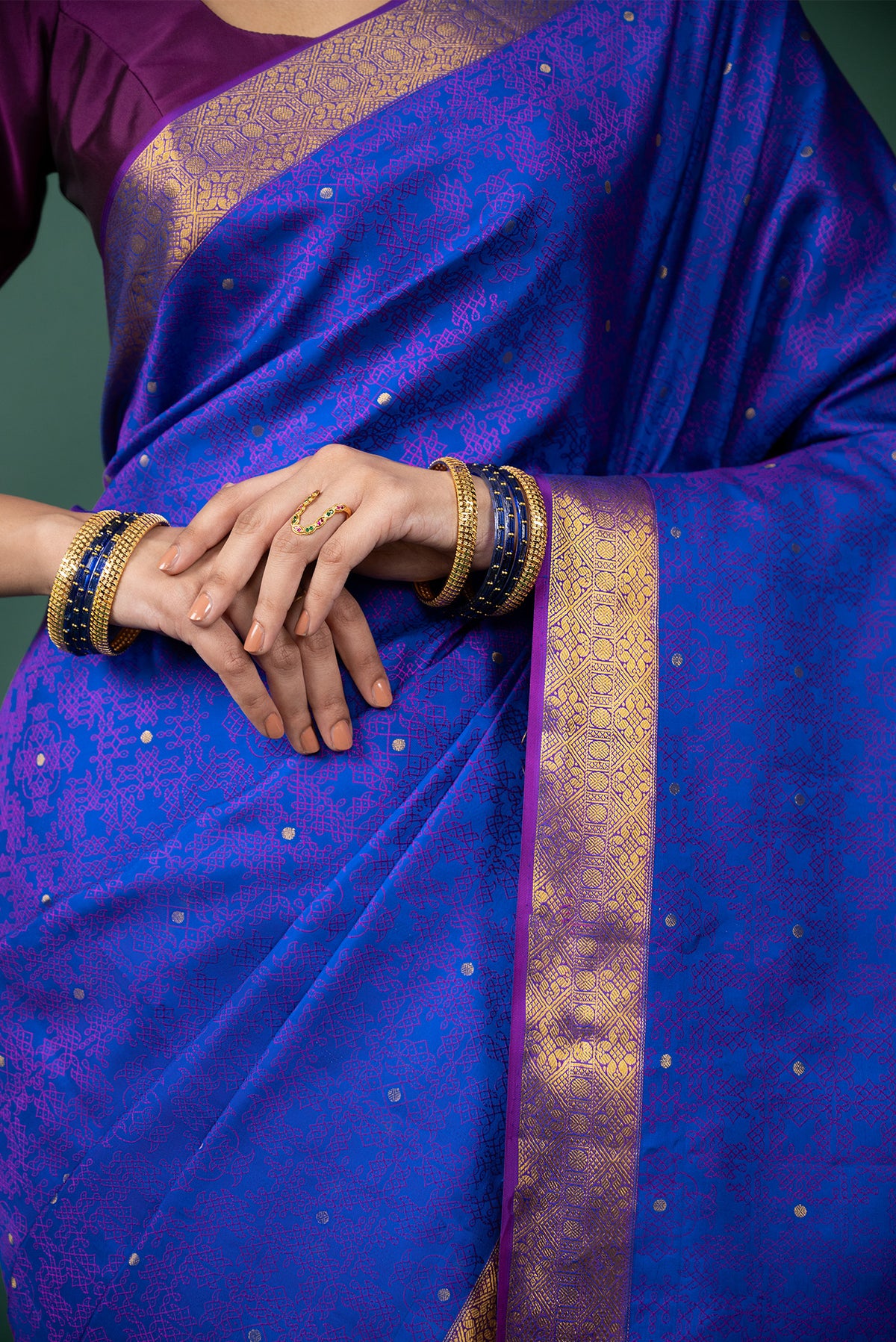 Close up image of the blouse of Blue Kanchipuram Silk Saree with Jacquard With Zari Butta on the body and Zari Border