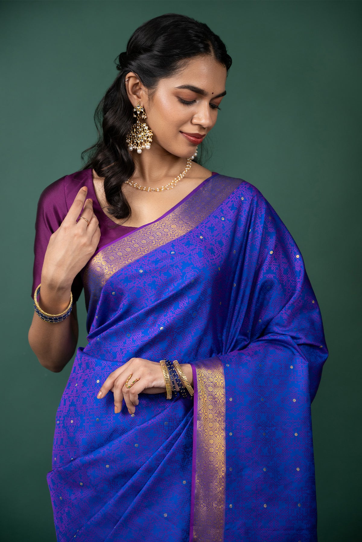 Close up of Blue Kanchipuram Silk Saree with Jacquard With Zari Butta on the body and Zari Border displaying folds