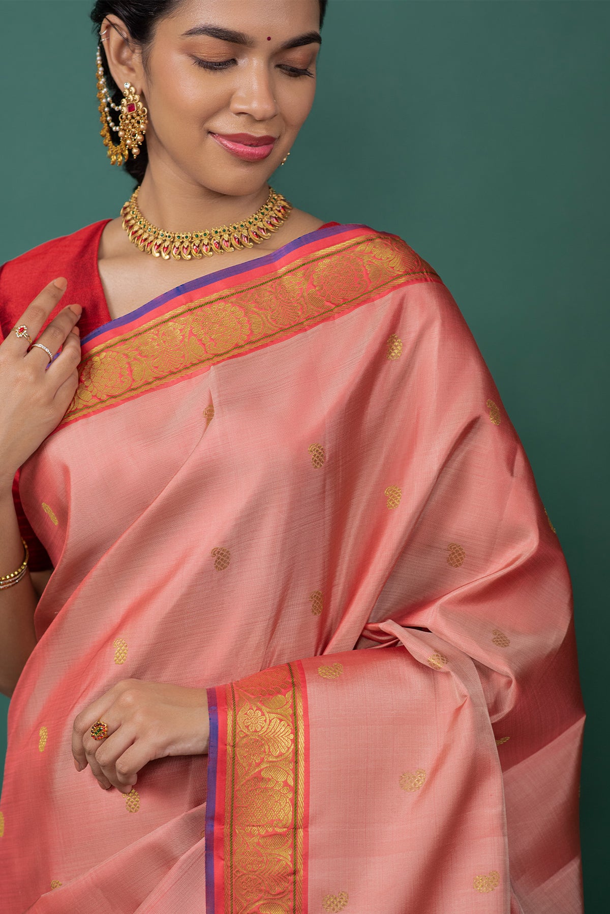 Close up of Mauve Kanchipuram Silk Saree with Zari Butta on the body and Zari Border displaying folds