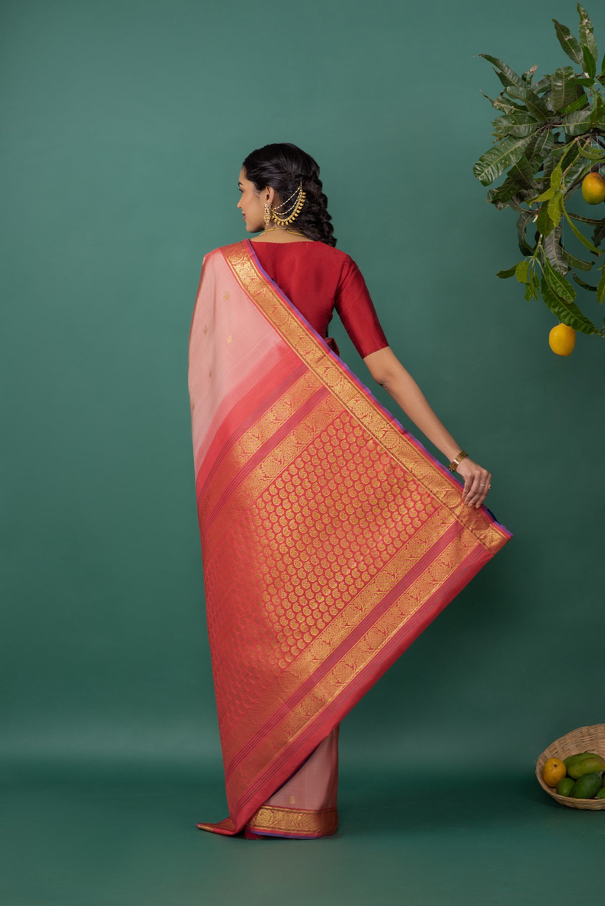Close up image of the pallu of Mauve Kanchipuram Silk Saree with Zari Butta on the body and Zari Border