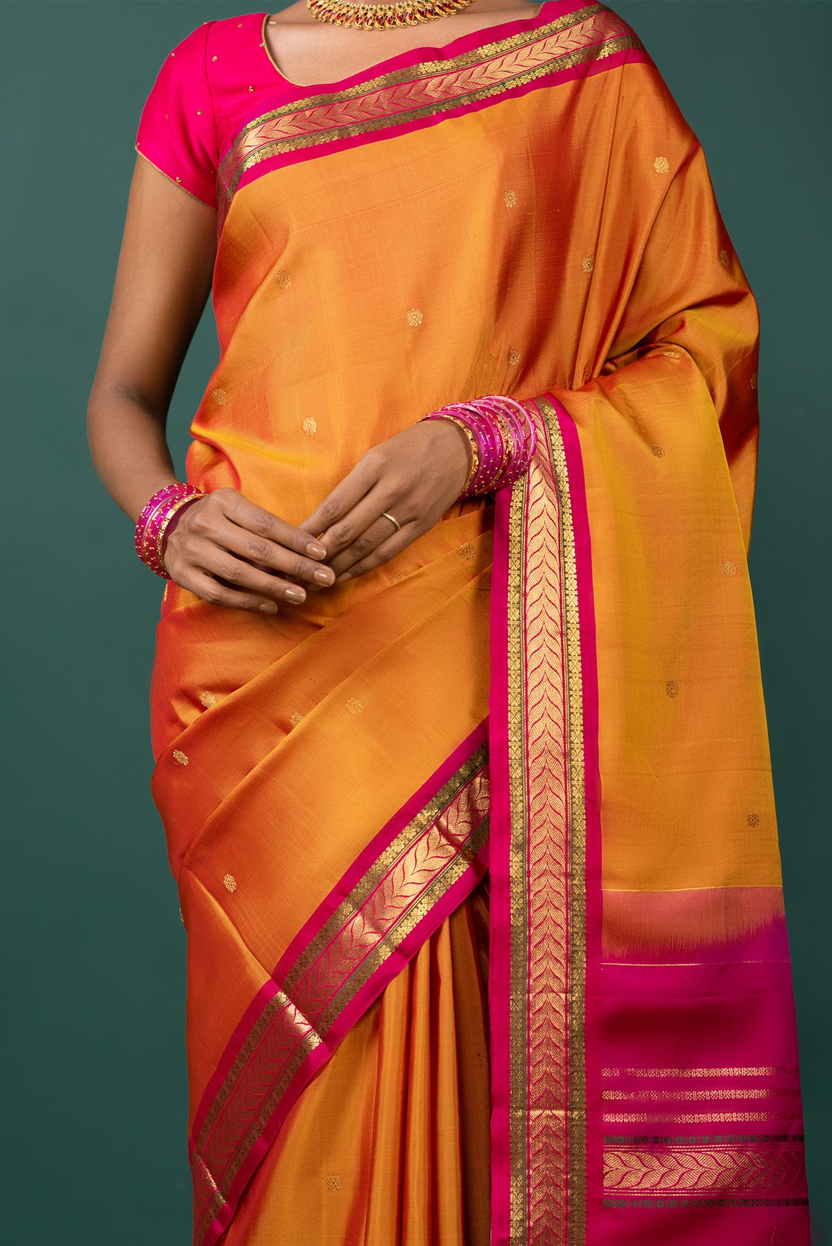 Close up image of the blouse of Mustard Kanchipuram Silk Saree with Zari Butta on the body and Zari Border