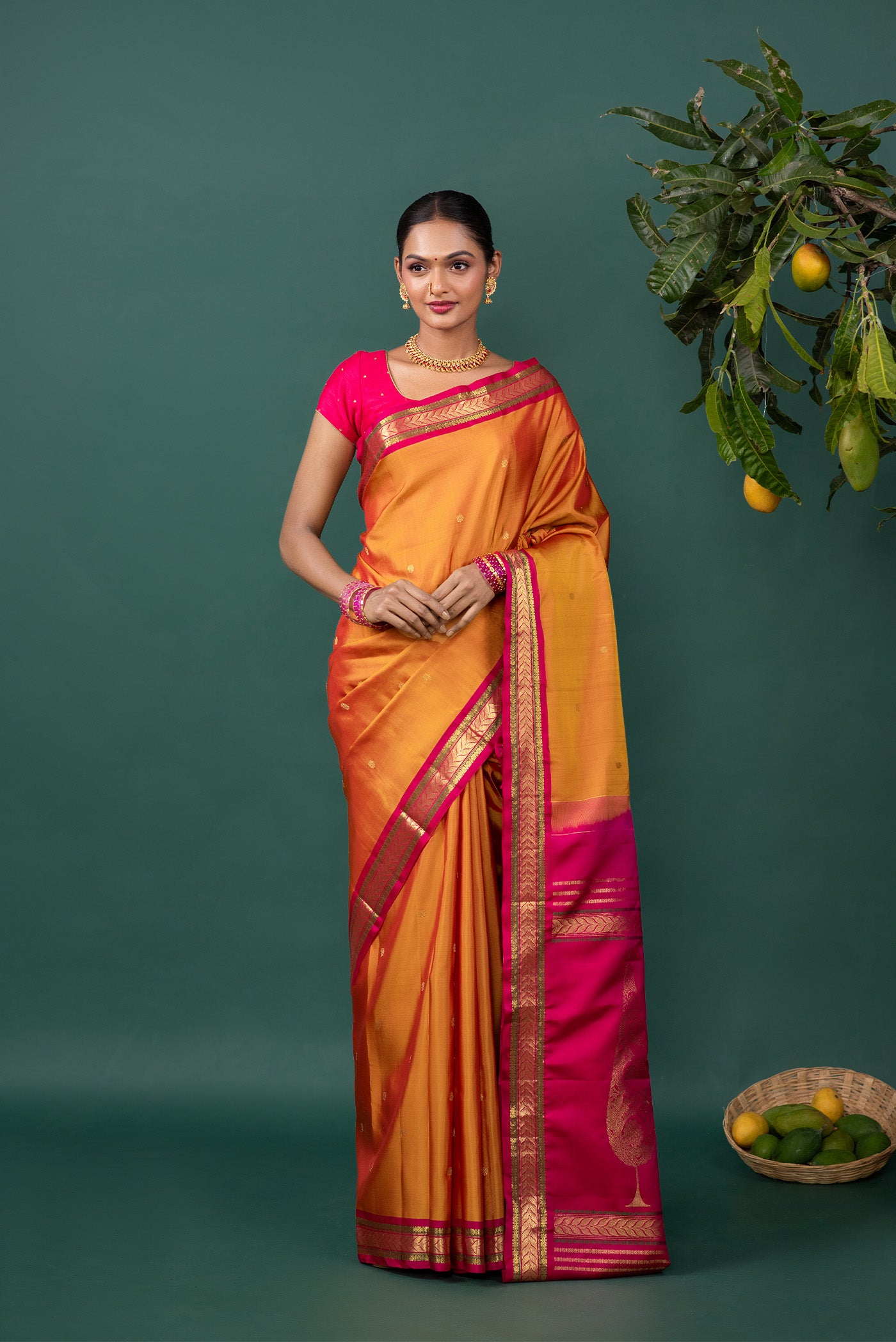 Mustard Kanchipuram Silk Saree with Zari Butta on the body and Zari Border displayed on a mannequin
