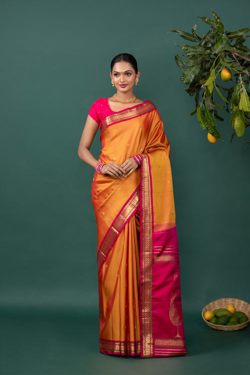 Mustard Kanchipuram Silk Saree with Zari Butta on the body and Zari Border displayed on a mannequin