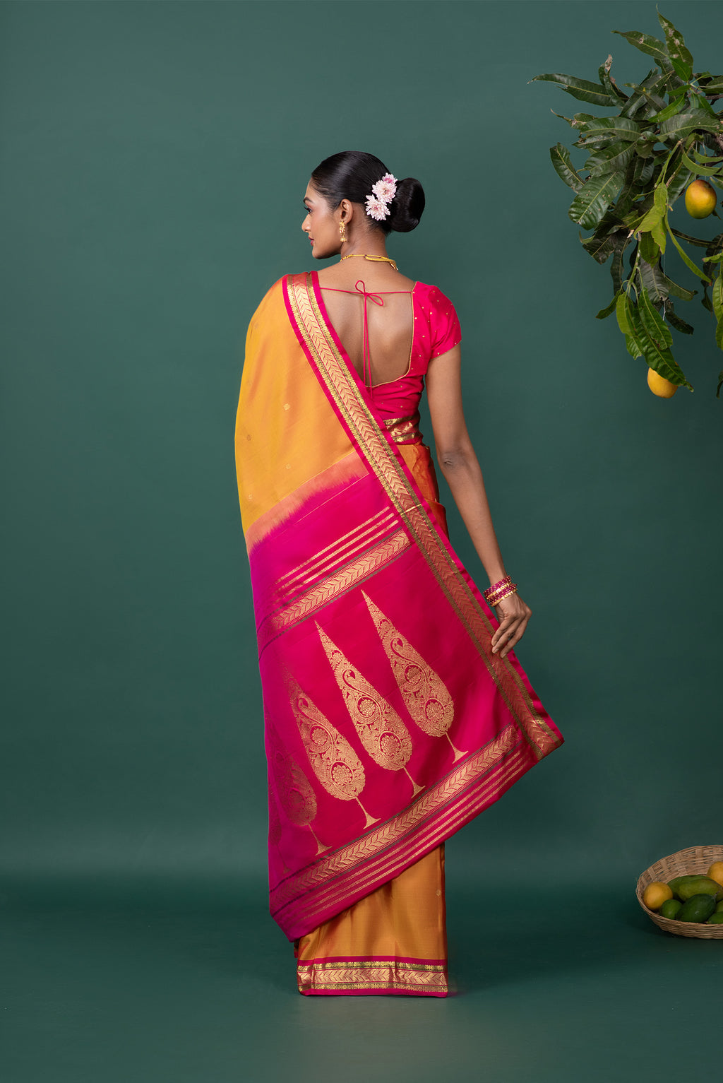 Close up image of the pallu of Mustard Kanchipuram Silk Saree with Zari Butta on the body and Zari Border
