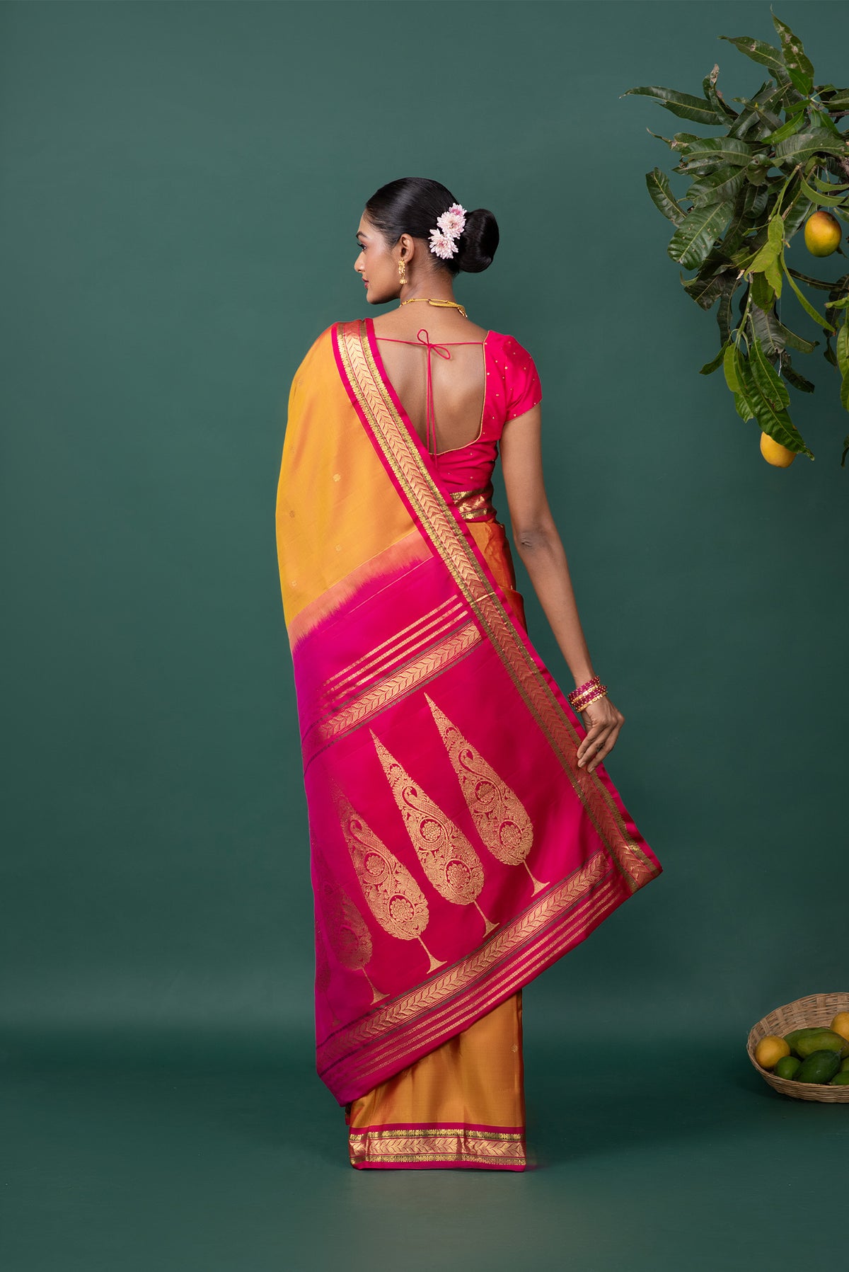 Close up image of the pallu of Mustard Kanchipuram Silk Saree with Zari Butta on the body and Zari Border