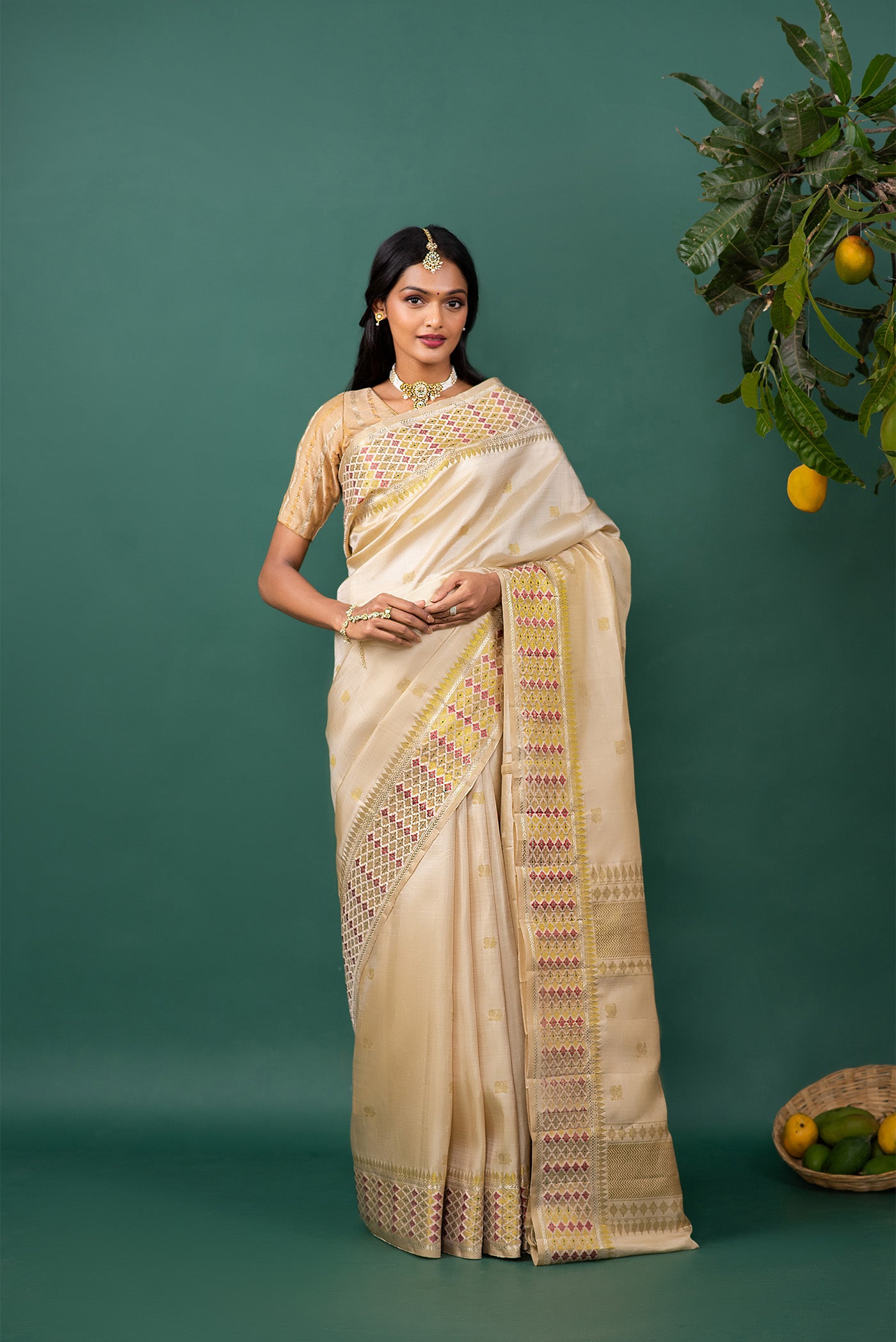 Beige Kanchipuram Silk Saree with Zari Butta on the body and Zari And Thread Border displayed on a mannequin