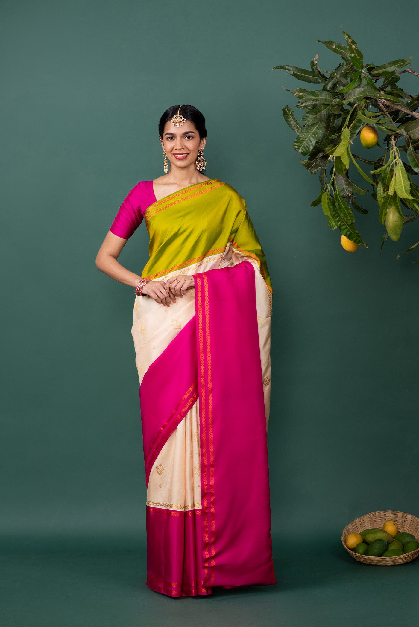 Multi Color Kanchipuram Silk Saree with Zari Butta on the body and Thread Border displayed on a mannequin