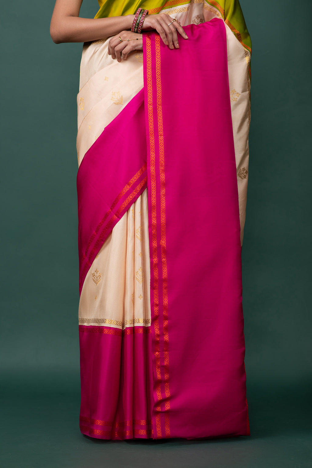 Pleats and pallu of Multi Color Kanchipuram Silk Saree with Zari Butta on the body and Thread Border