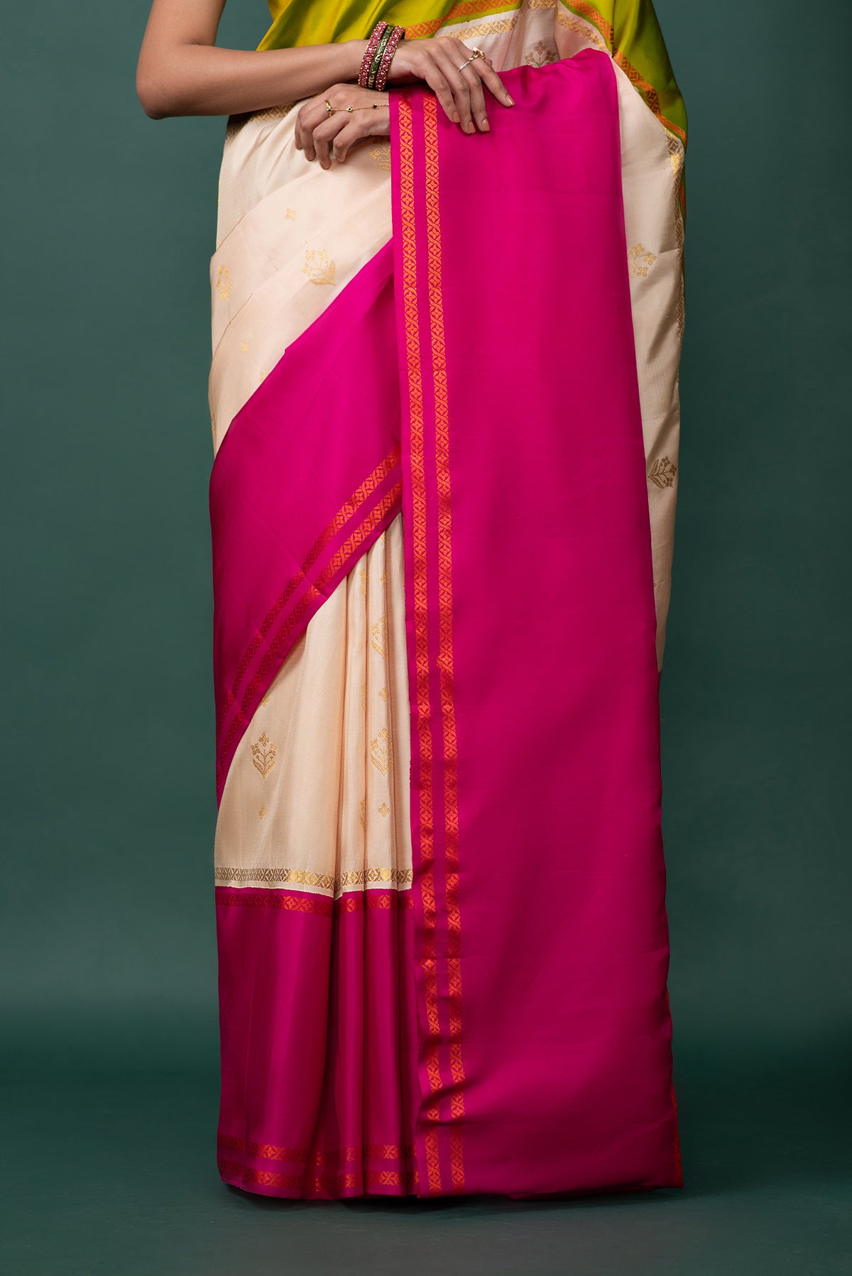 Pleats and pallu of Multi Color Kanchipuram Silk Saree with Zari Butta on the body and Thread Border