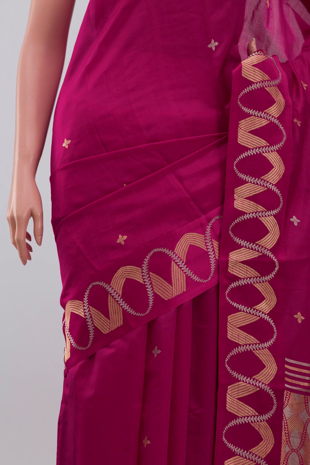 Close up of Pink Banarasi Katan Silk Saree with Zari Butta on the body and Zari Border displaying folds