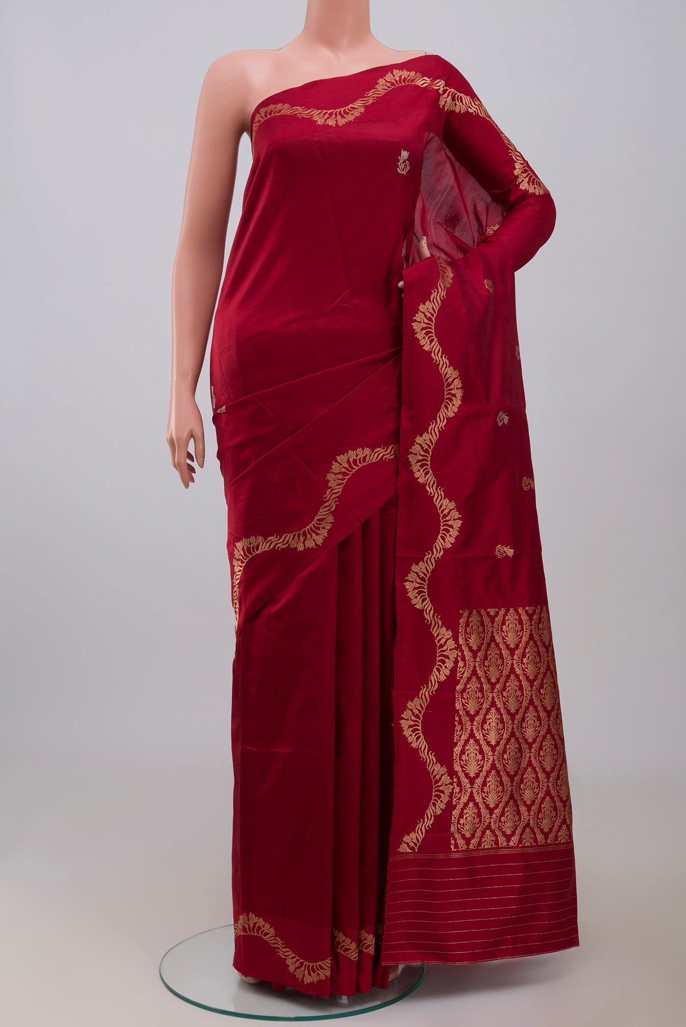 Maroon Banarasi Katan Silk Saree with Zari Butta on the body and Zari Border displayed on a mannequin