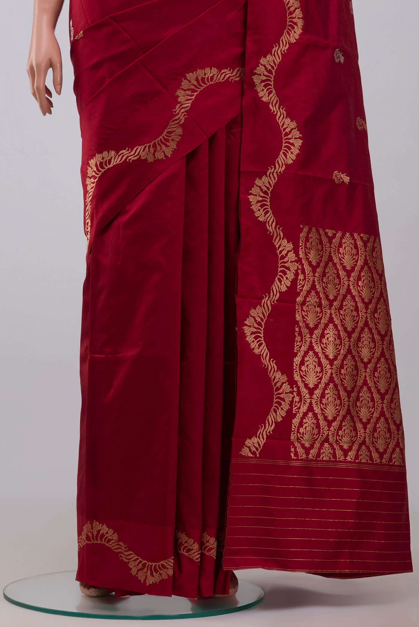 Pleats and pallu of Maroon Banarasi Katan Silk Saree with Zari Butta on the body and Zari Border