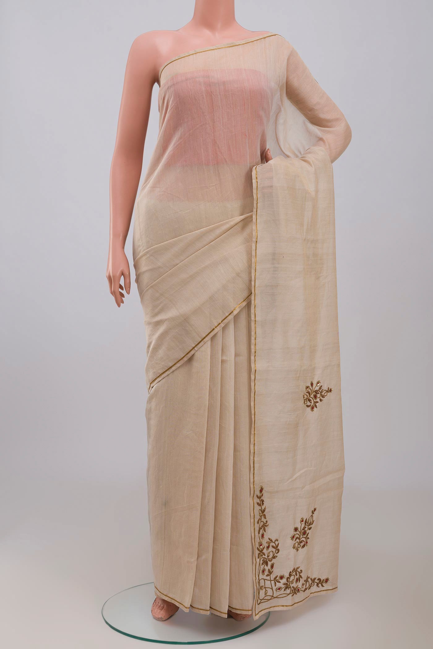 Beige Chanderi Silk Cotton Saree with Embroidery on the body and Thin Zari Line displayed on a mannequin