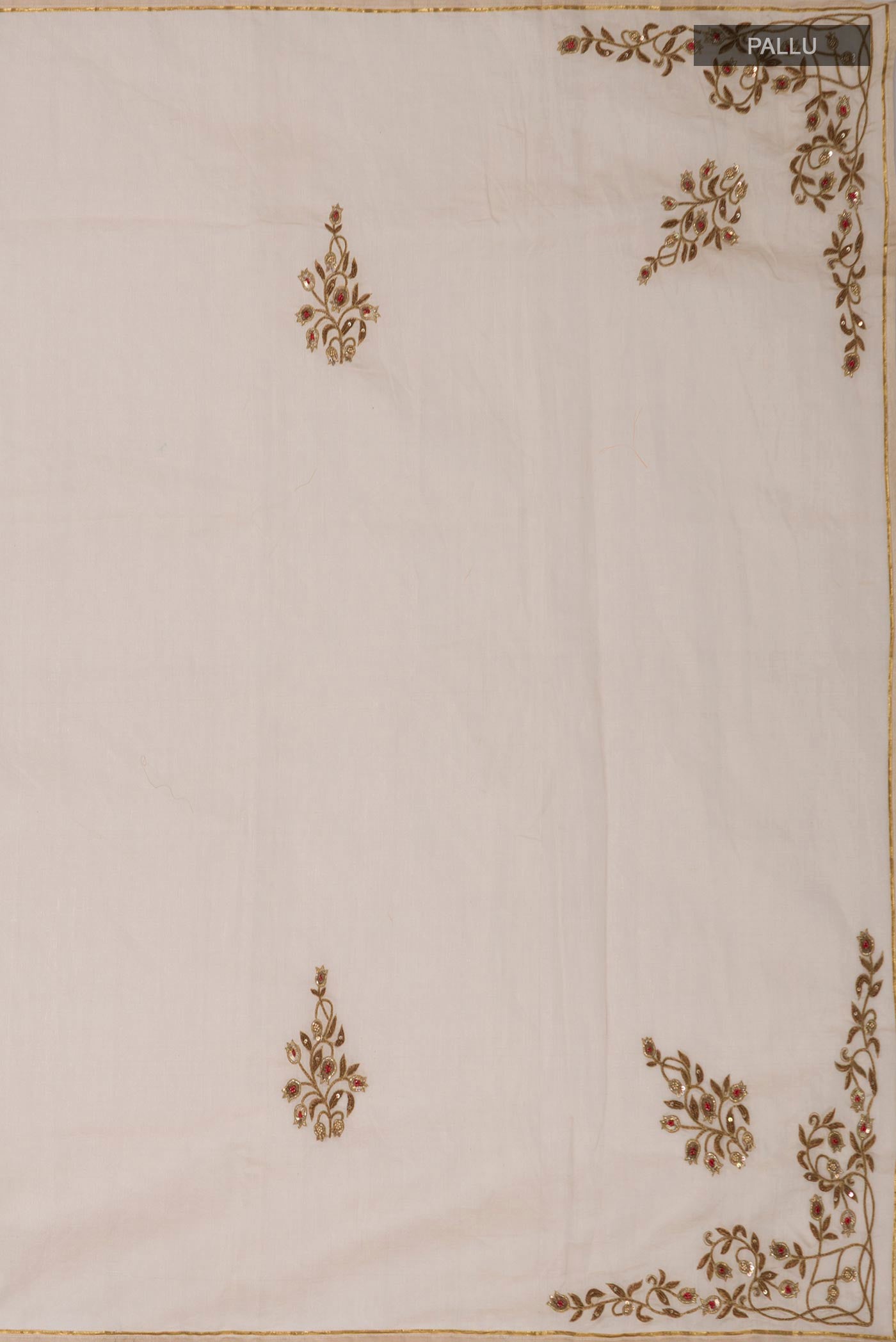 Close up image of the pallu of Beige Chanderi Silk Cotton Saree with Embroidery on the body and Thin Zari Line