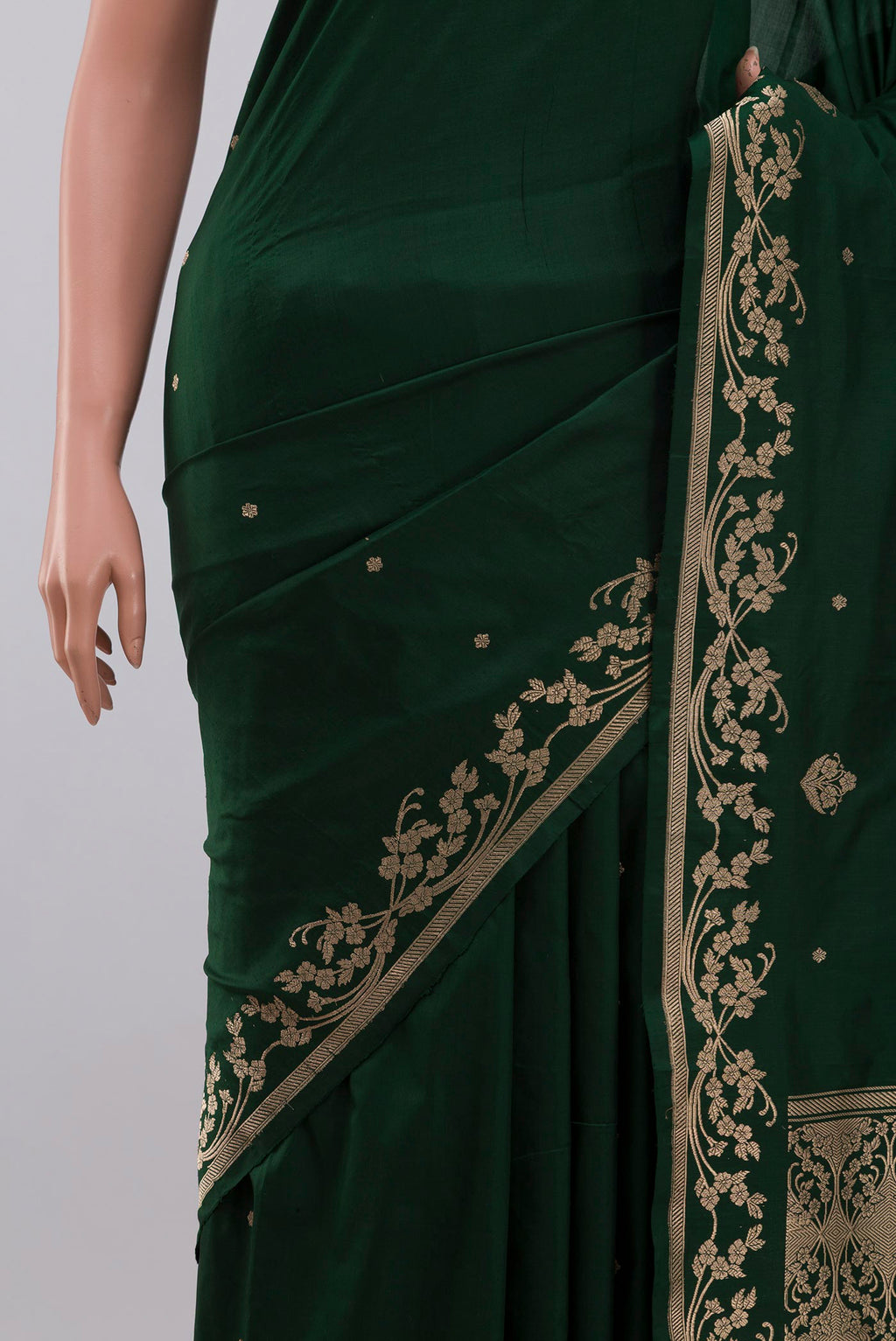 Close up of Green Banarasi Katan Silk Saree with Zari Butta on the body and Zari Border displaying folds