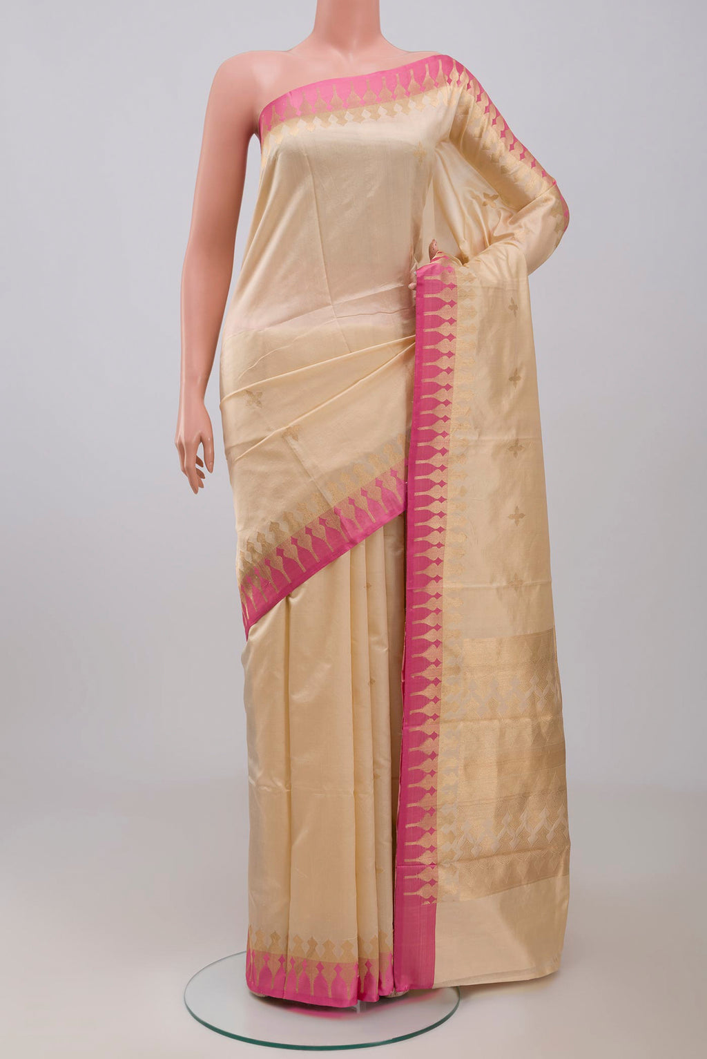 Beige Banarasi Silk Saree with Zari Butta on the body and Zari Border displayed on a mannequin