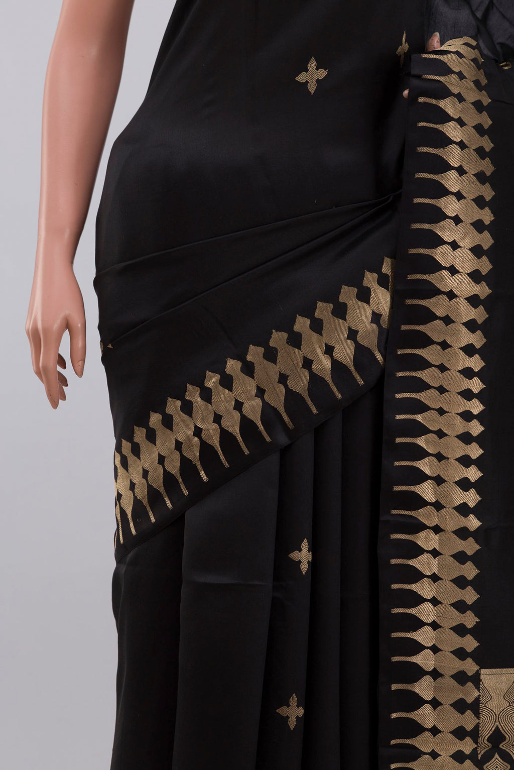 Close up of Black Banarasi Silk Saree with Zari Butta on the body and Zari Border displaying folds