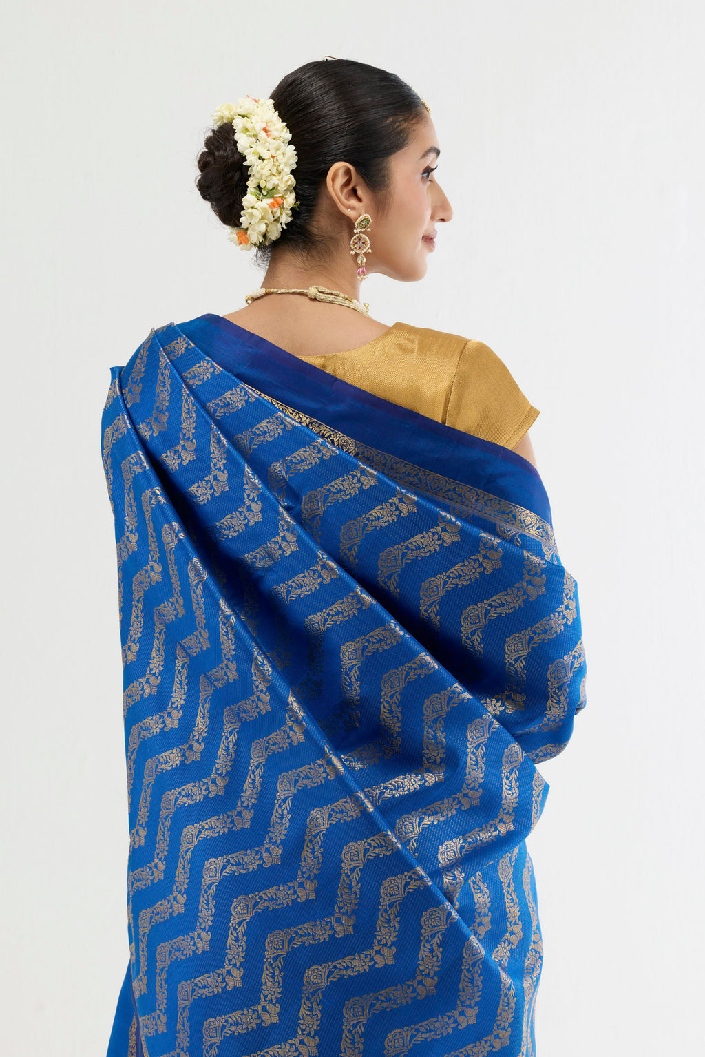 Close up image of the pallu of Blue Kanchipuram Silk Saree with Zari Butta on the body and Zari Border