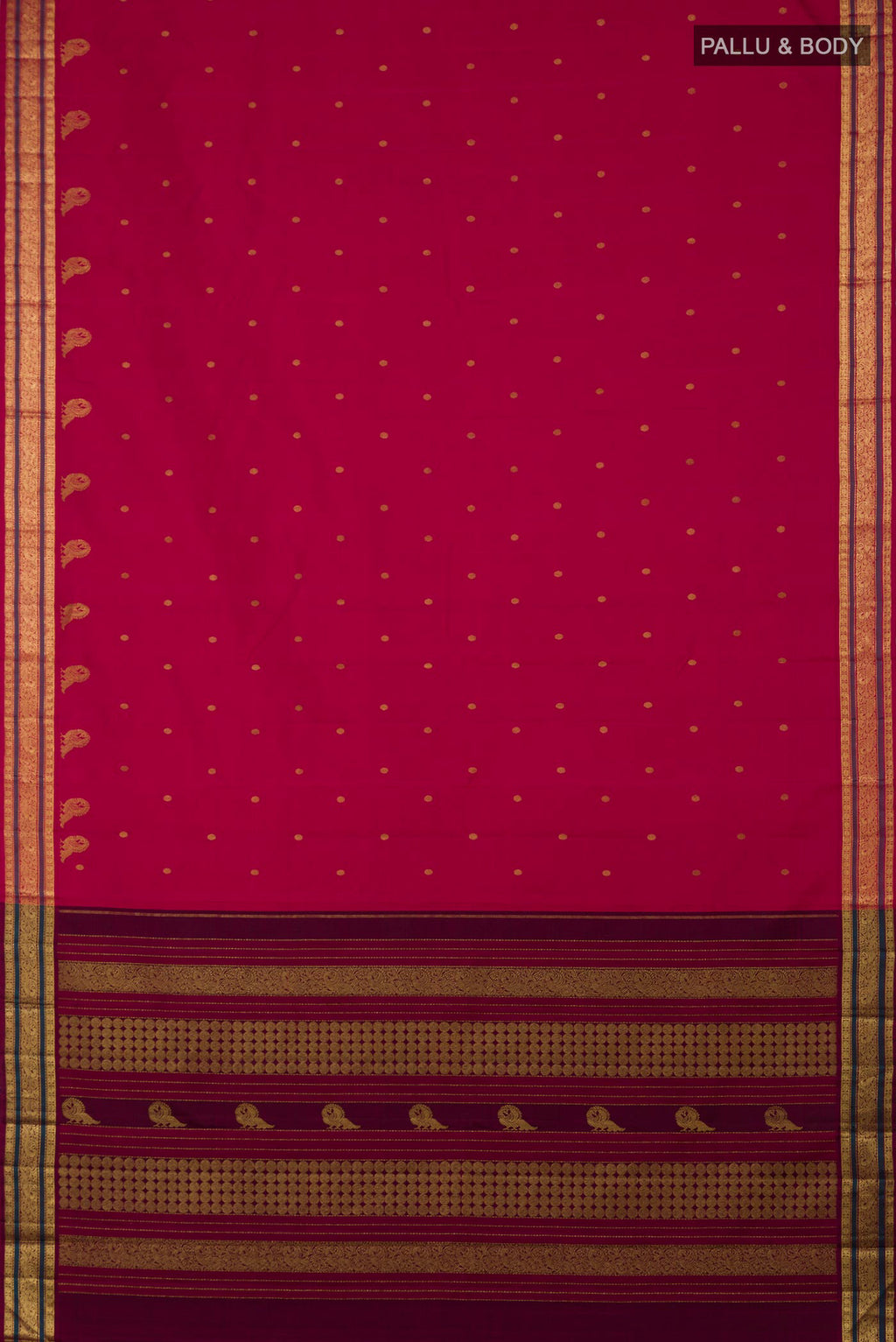 Flat view of Aaradhya unfolds in a vibrant scarlet red, adorned with delicate rudraksh butas that bring depth and rhythm to the weave. The 3-inch borders feature mayil zari pet and rudraksh pet framed by contrasting silk bands. Along the lower border, graceful mayils with unfurled wings create a striking visual detail. The pallu is highlighted by a distinctive grid pattern accented with vibrant green bands