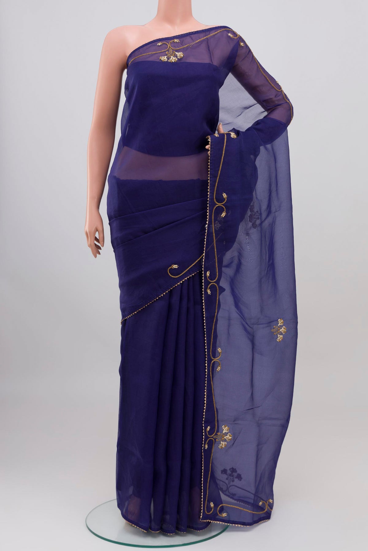 Blue Organza Silk Saree with Embroidery on the body and Embroidery Border displayed on a mannequin