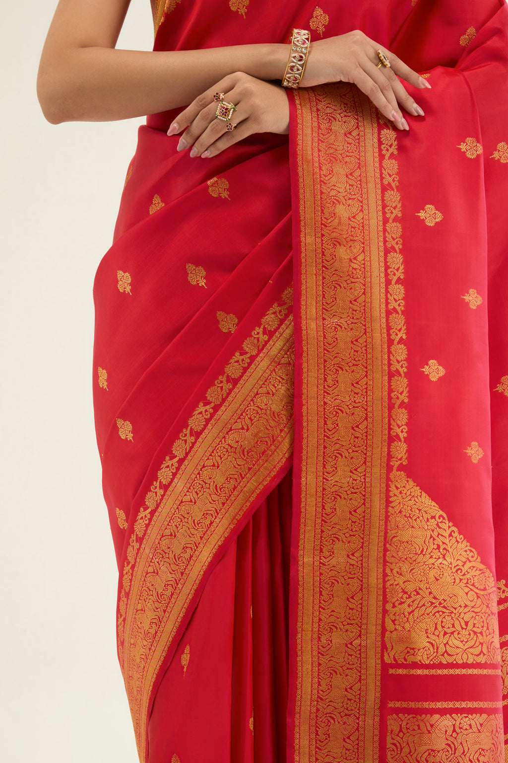 Close up image of the blouse of Red Kanchipuram Silk Saree with Zari Brocade on the body and Zari Border