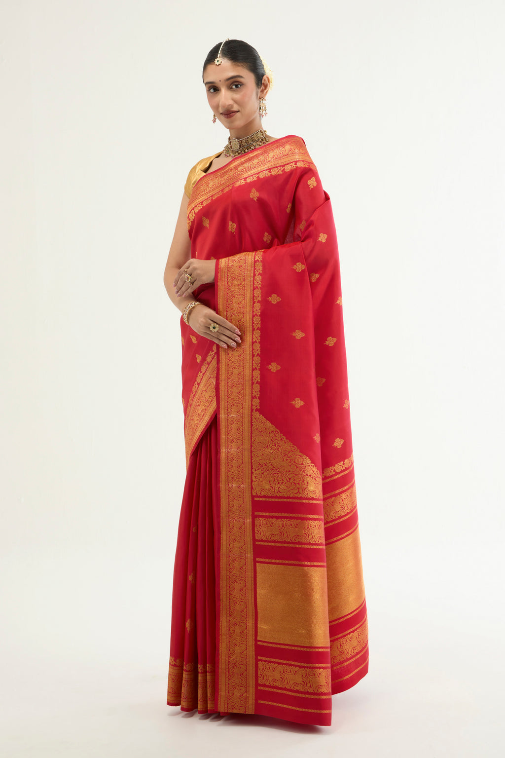 Close up of Red Kanchipuram Silk Saree with Zari Brocade on the body and Zari Border displaying folds