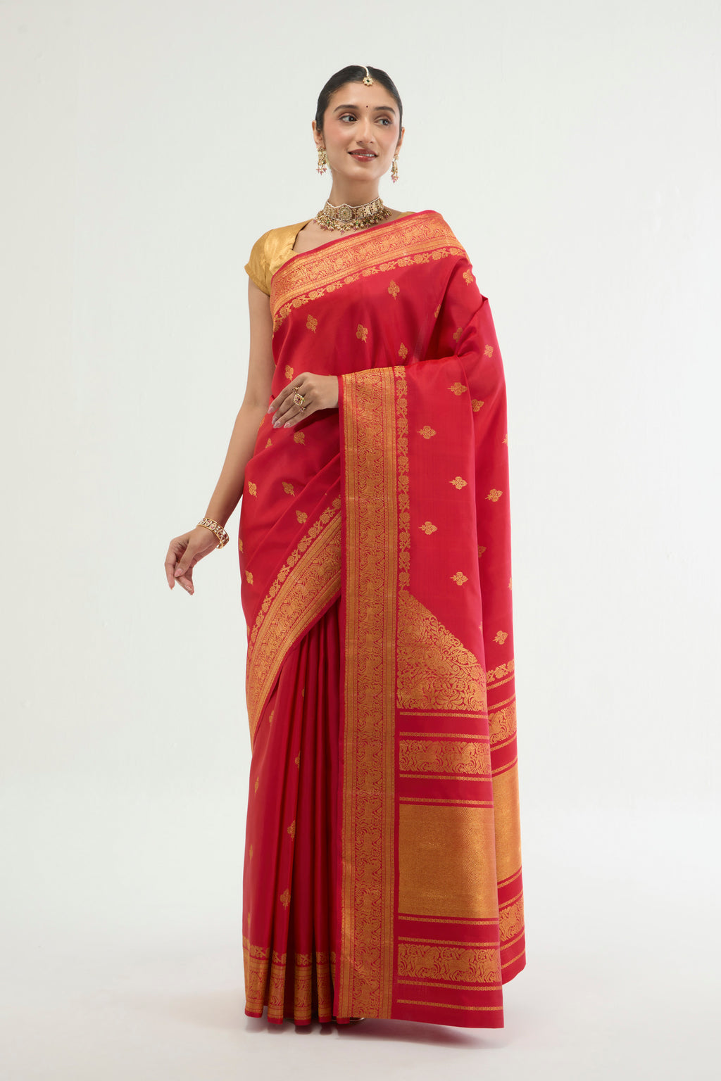 Red Kanchipuram Silk Saree with Zari Brocade on the body and Zari Border displayed on a mannequin