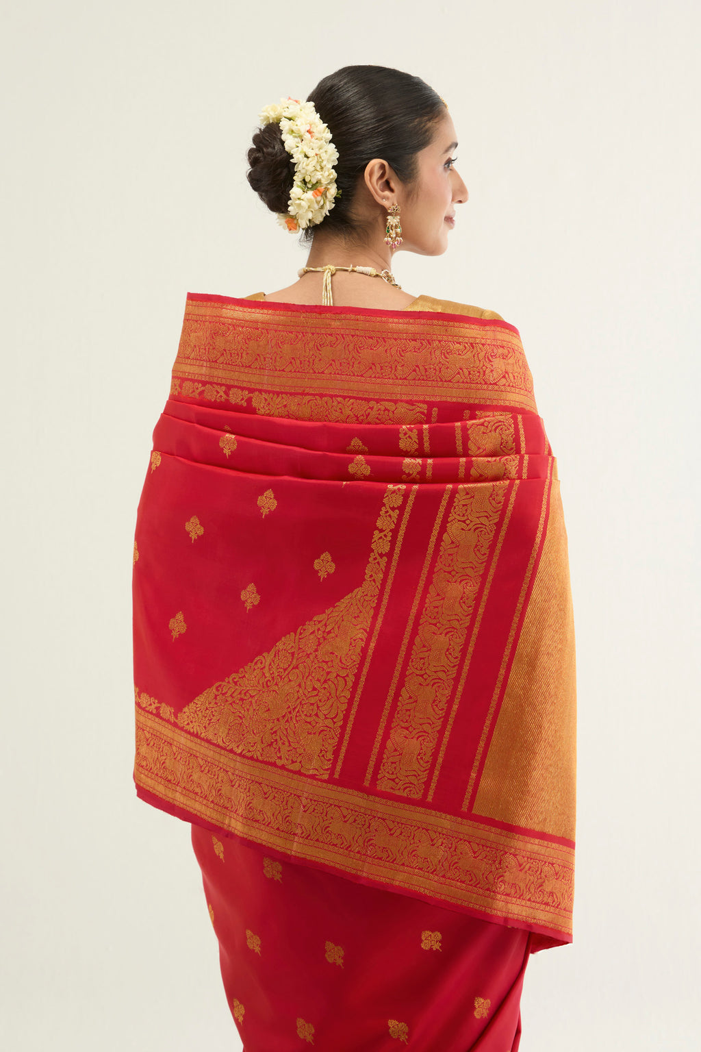 Close up image of the pallu of Red Kanchipuram Silk Saree with Zari Brocade on the body and Zari Border