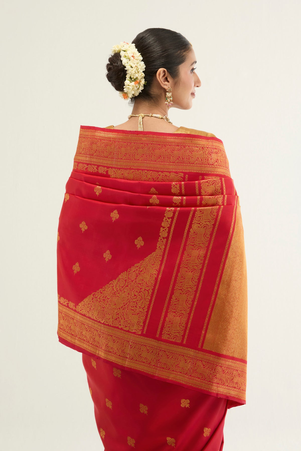 Close up image of the pallu of Red Kanchipuram Silk Saree with Zari Brocade on the body and Zari Border