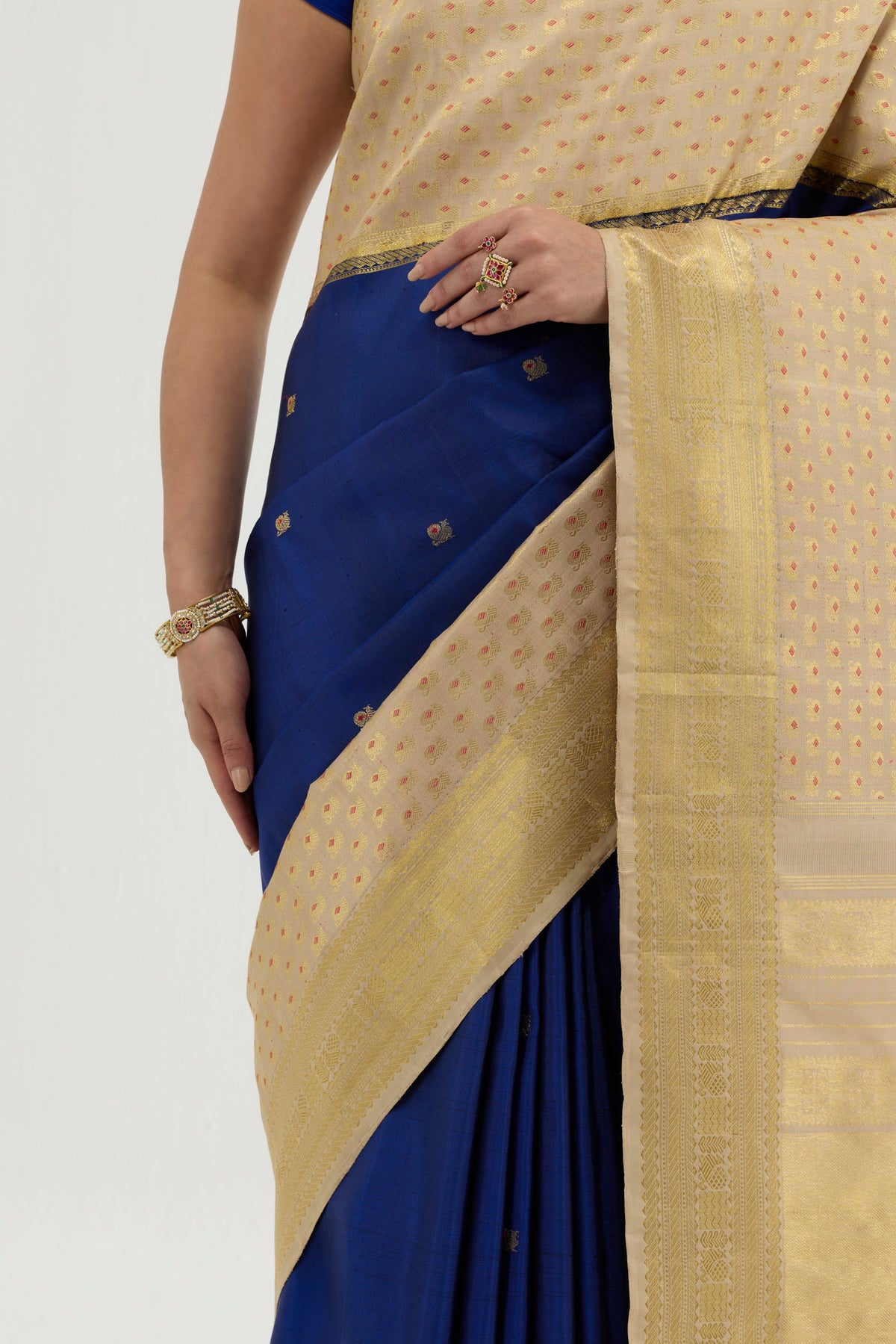 Close up image of the blouse of Multi Color Kanchipuram Silk Saree with Zari And Thread Butta on the body and Zari Border