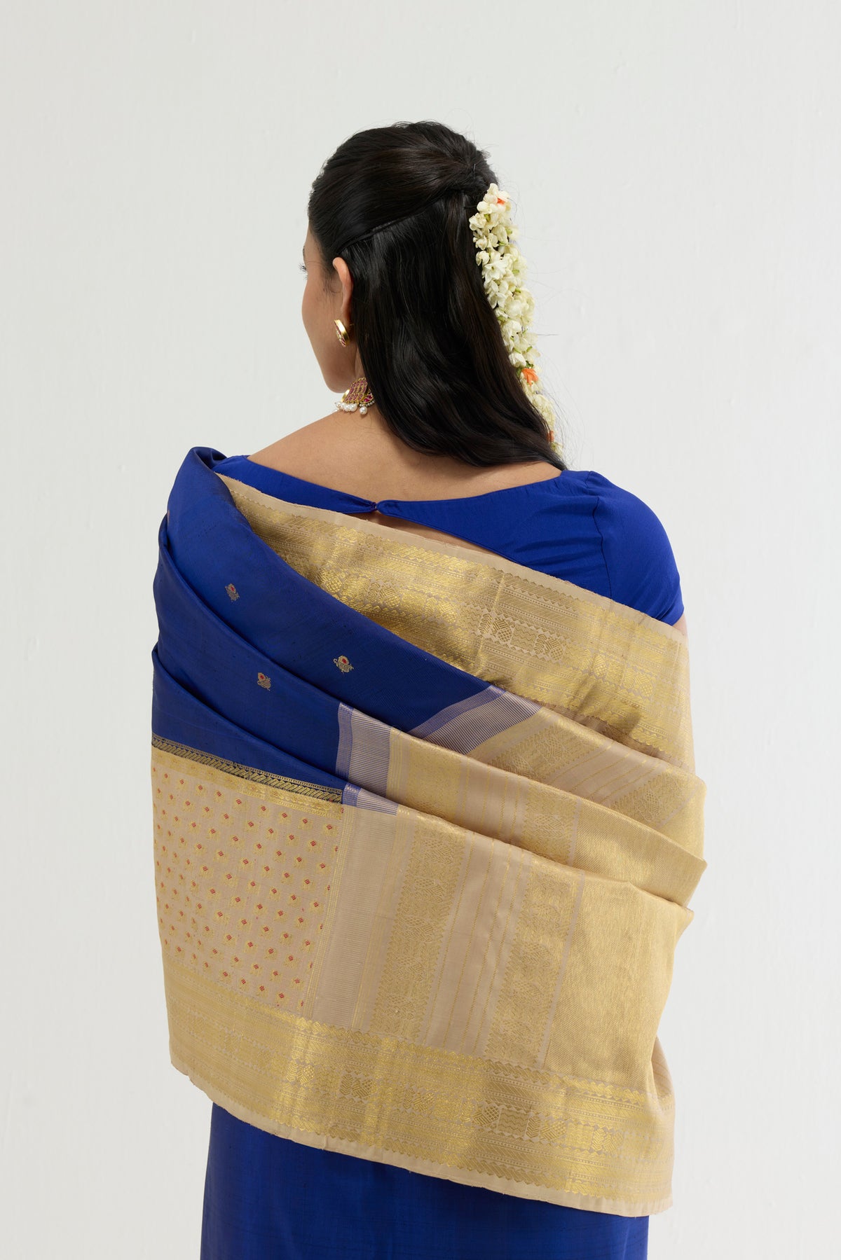 Close up image of the pallu of Multi Color Kanchipuram Silk Saree with Zari And Thread Butta on the body and Zari Border