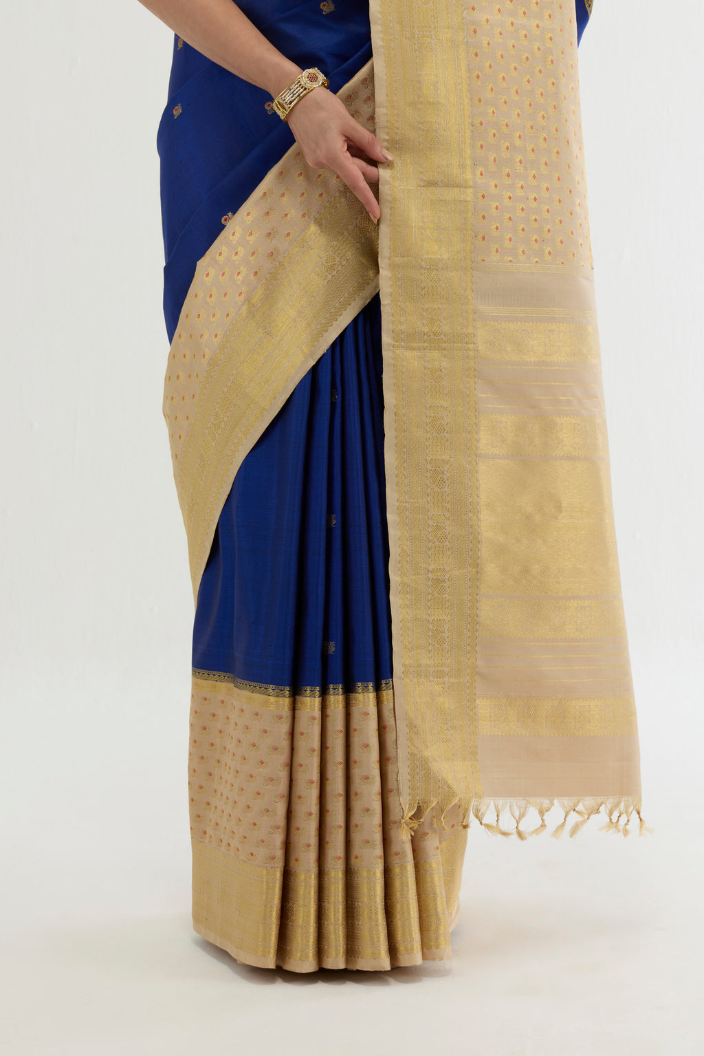 Pleats and pallu of Multi Color Kanchipuram Silk Saree with Zari And Thread Butta on the body and Zari Border