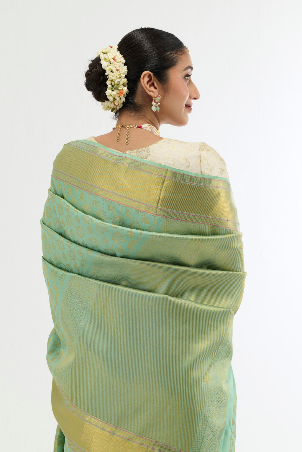 Close up image of the pallu of Green Kanchipuram Silk Saree with Zari Brocade on the body and Zari Border