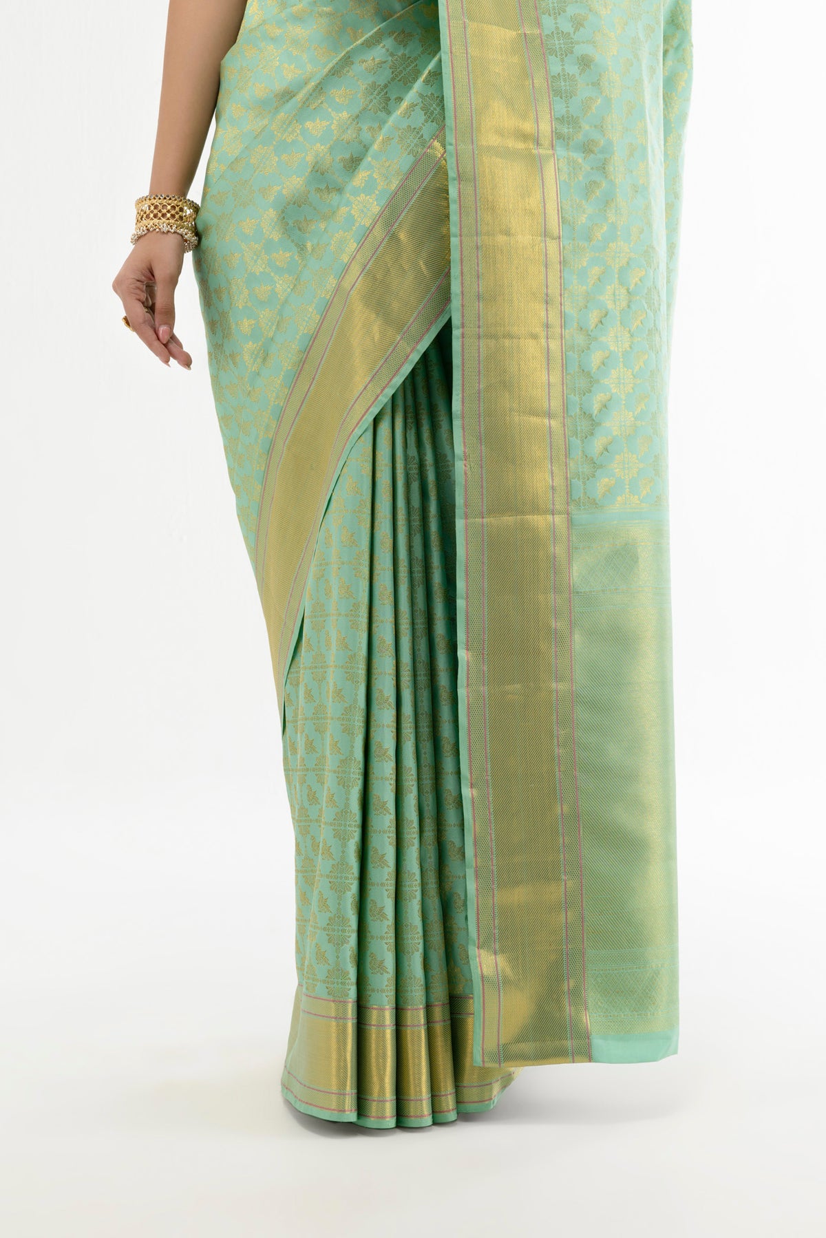 Pleats and pallu of Green Kanchipuram Silk Saree with Zari Brocade on the body and Zari Border
