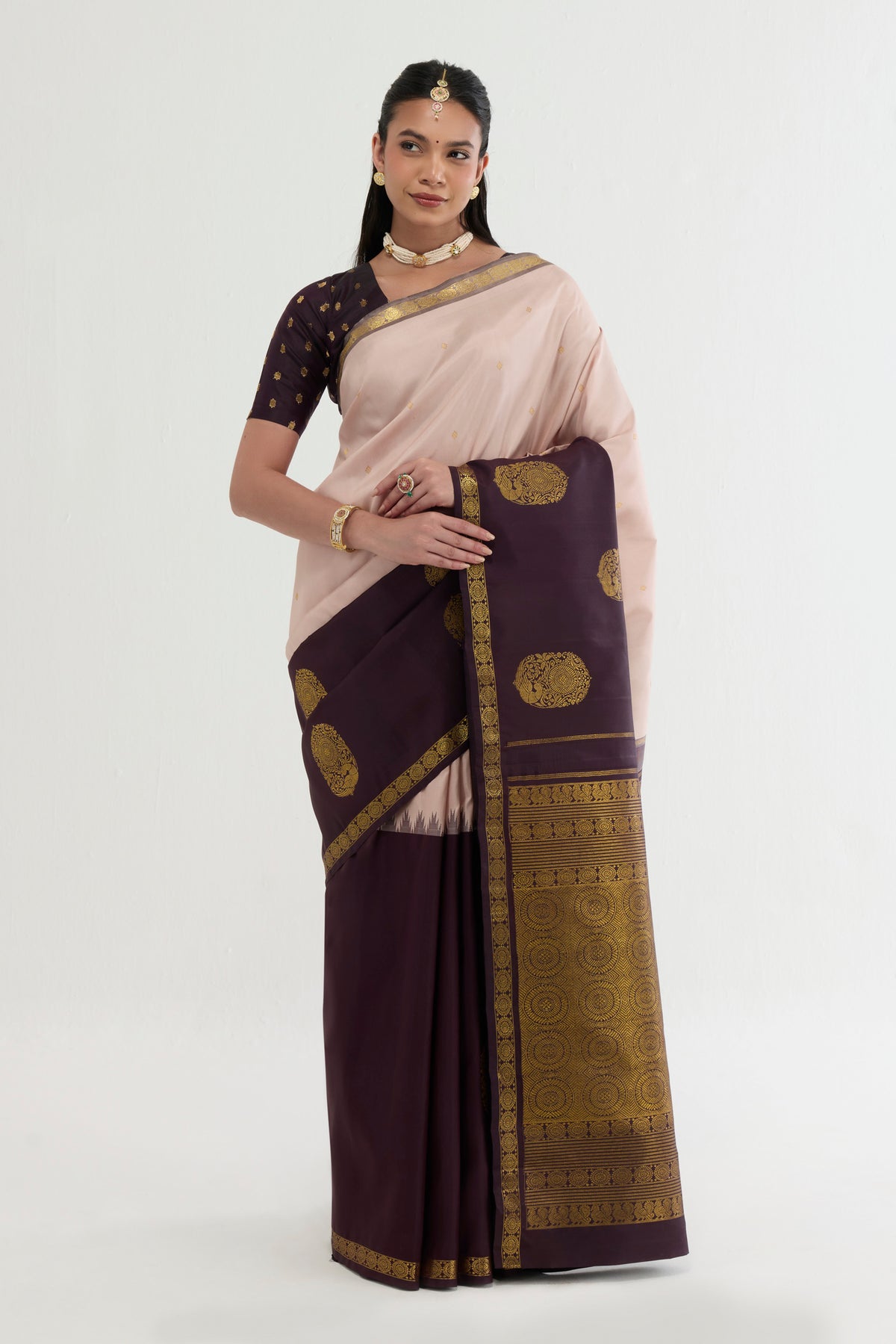 Multi Color Kanchipuram Silk Saree with Zari Butta on the body and Zari Border displayed on a mannequin