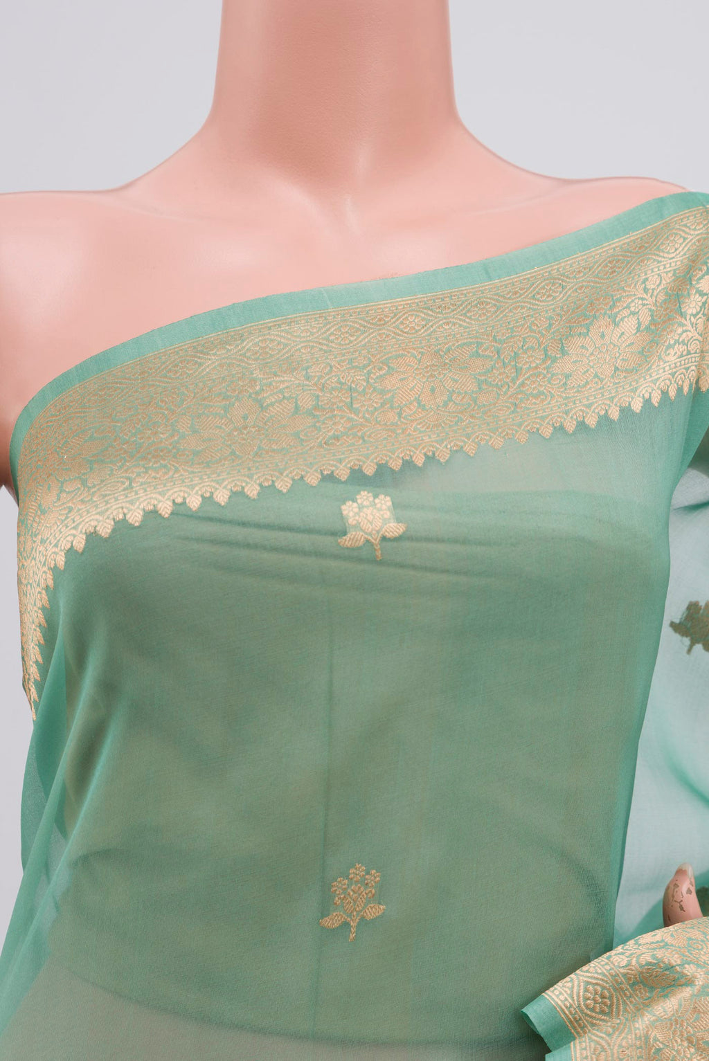Border image of Green Organza Silk Saree with Zari Butta on the body and Zari Border