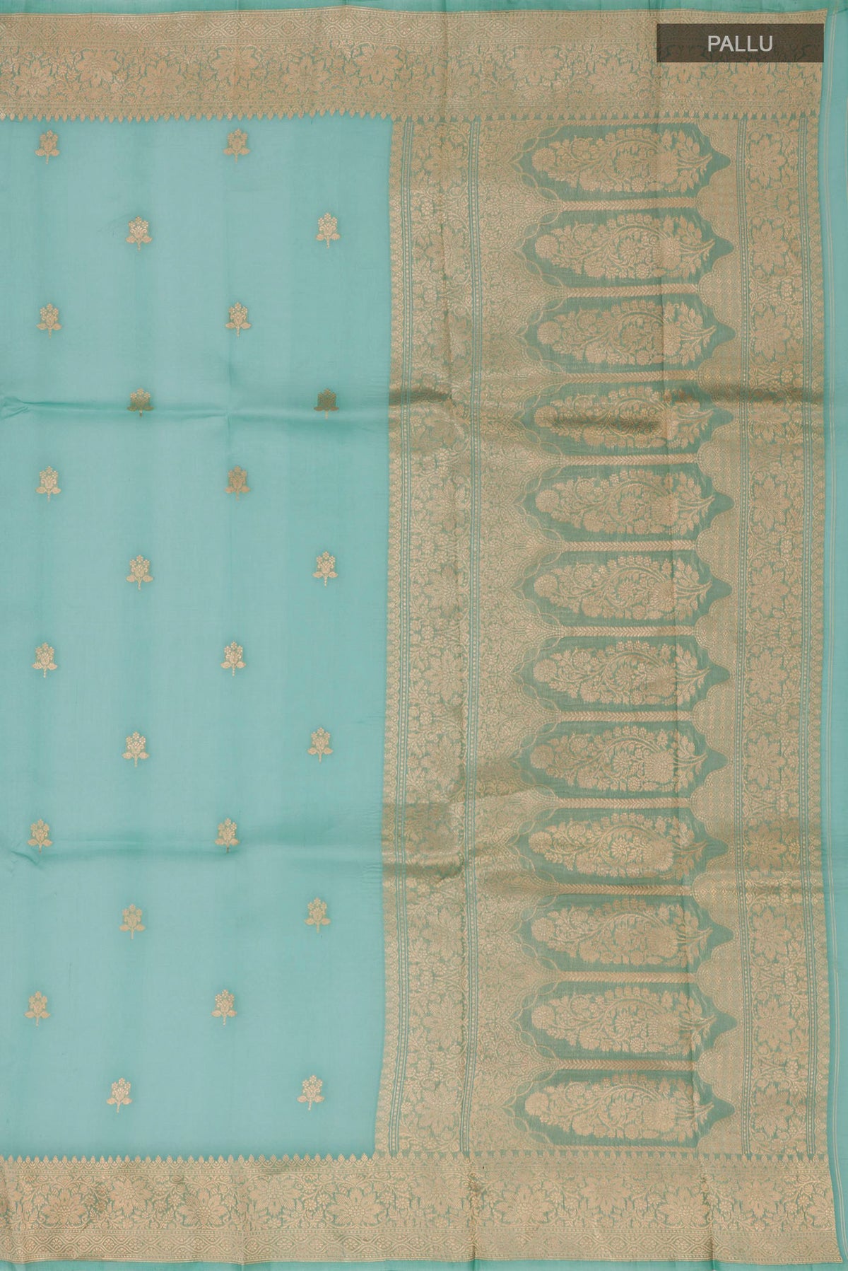 Close up image of the pallu of Green Organza Silk Saree with Zari Butta on the body and Zari Border