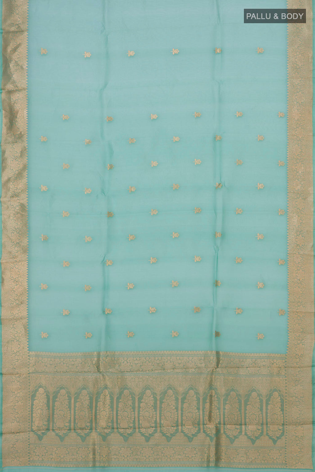 Flat view of Green Organza Silk Saree with Zari Butta on the body and Zari Border