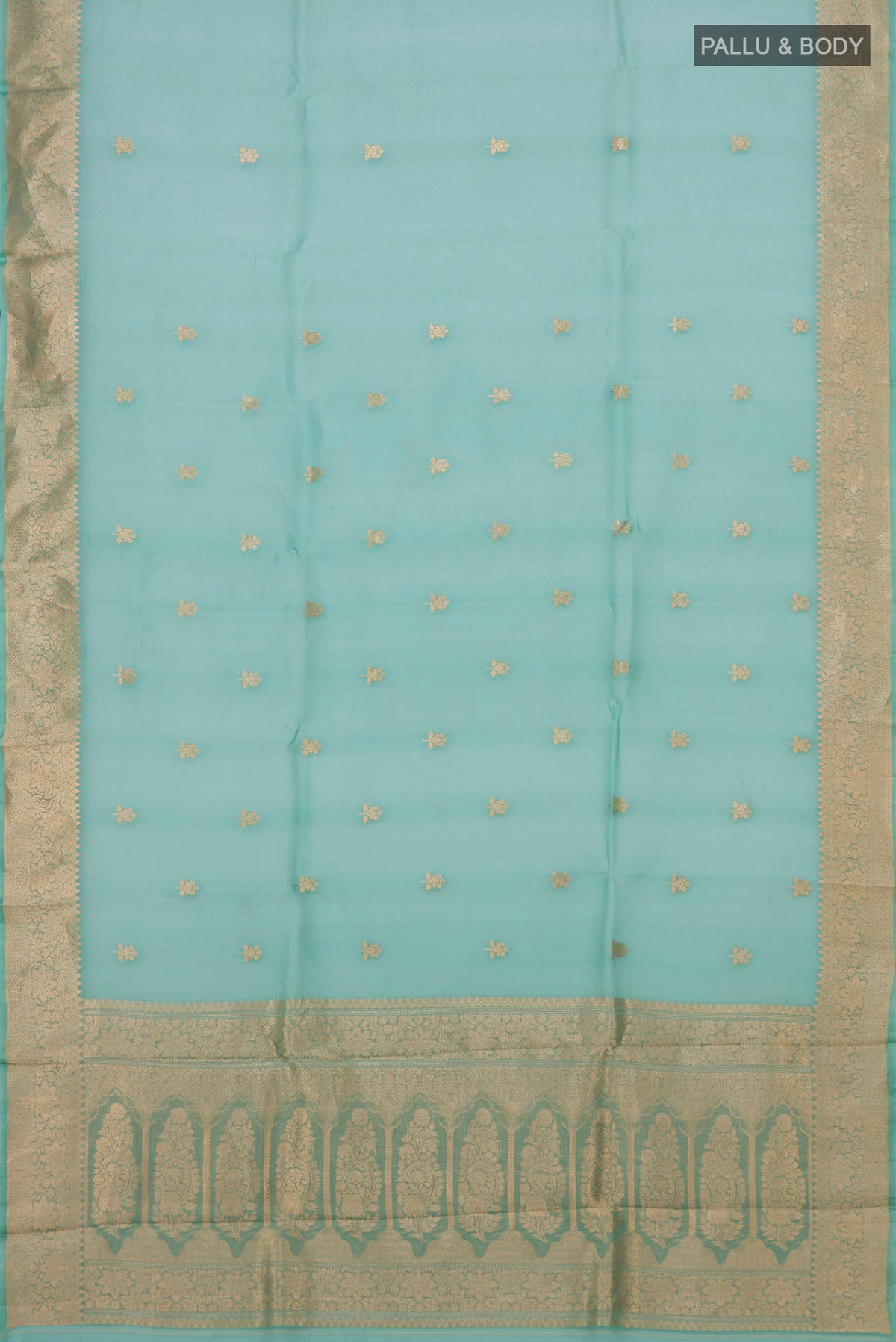 Flat view of Green Organza Silk Saree with Zari Butta on the body and Zari Border