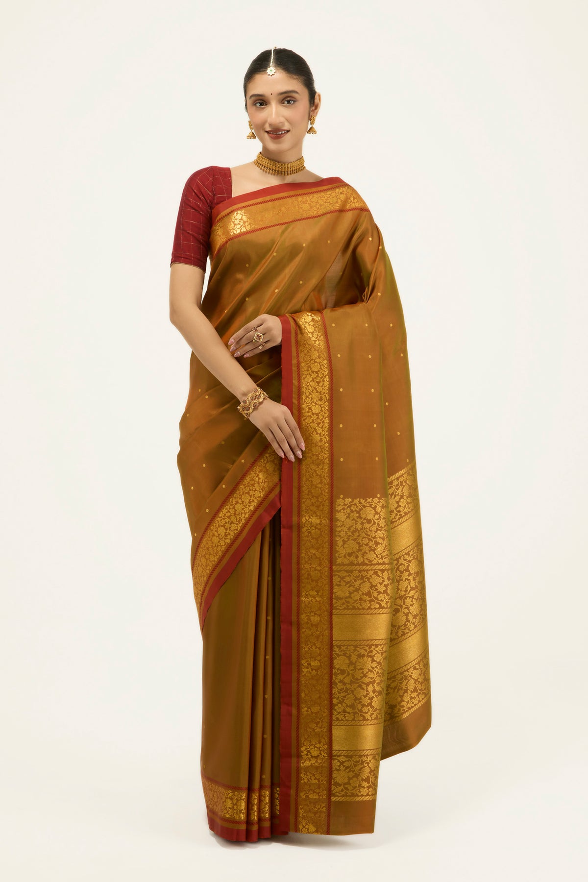 Mustard with Green Color Kanchipuram Silk Saree with Zari Butta on the body and Zari Border displayed on a mannequin