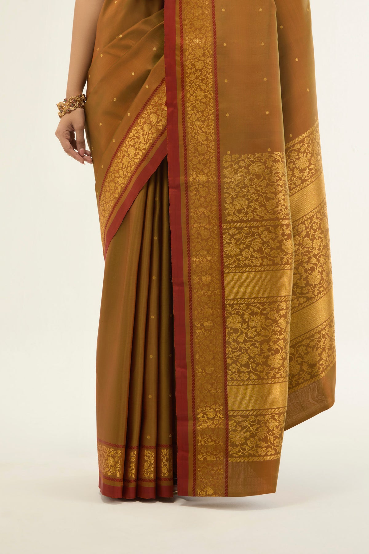 Pleats and pallu of Mustard with Green Color Kanchipuram Silk Saree with Zari Butta on the body and Zari Border